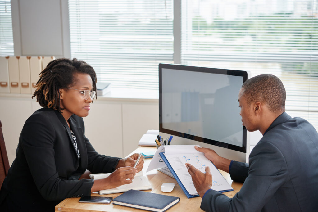 Afro American Man Suit Holding Documents Talking Female Boss 1024x683